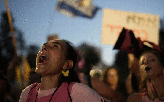 Police drag protesters from rails as Israelis rally for Gaza ceasefire